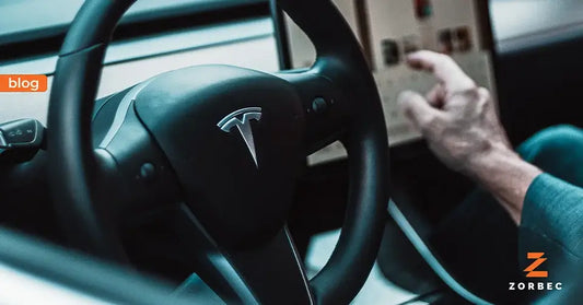 Life with Tesla Model 3 & Model Y steering wheel and control panel in a Tesla vehicle.